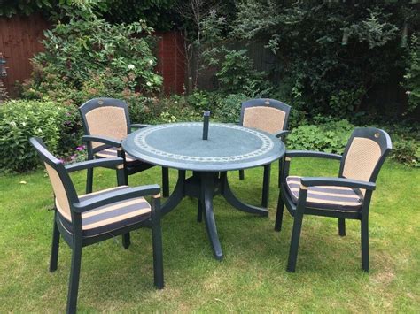 Hartman Dark Green Resin Patio Table 150cm With 4 Armchairs Inc