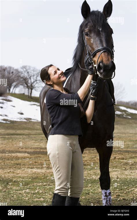 Woman with horse Stock Photo - Alamy