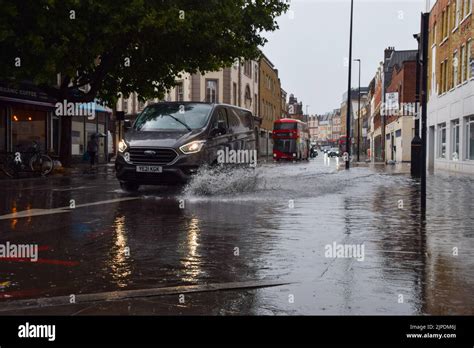 London England Uk 17th Aug 2022 A Car Splashes Through A Flooded