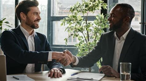 Premium AI Image Two Successful Diverse Businessmen Sit At Office