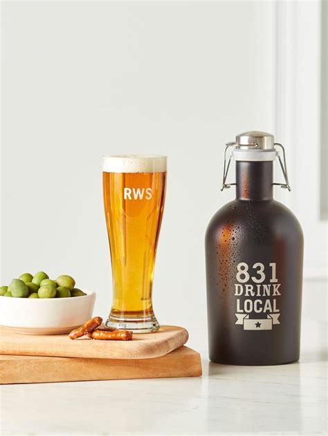 A Bottle Of Beer Next To A Bowl Of Green Olives On A Cutting Board