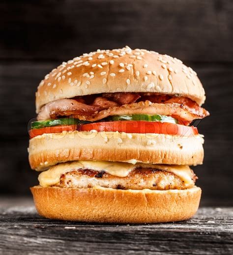 Double burger with chicken patty, bacon ... | Stock image | Colourbox