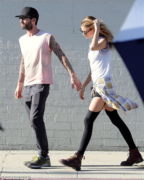 Behati Prinsloo Shares A Tender Kiss With Adam Levine On Set Of Animal