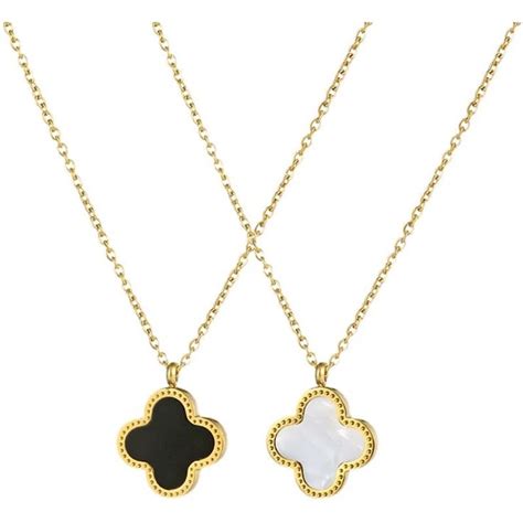 Two Gold Necklaces With Black And White Clover Pendants On Each One