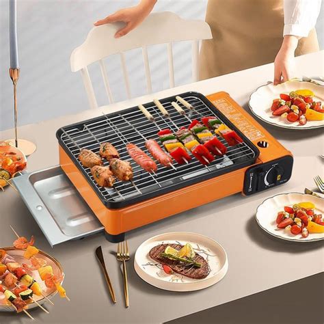 Небольшой гриль-барбекю с системой газового зажигания U-образной формы ...