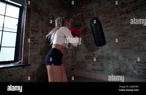 Boxing A Female Fighter Trains Her Punches Hits A Punching Bag Training Day In Stock Video