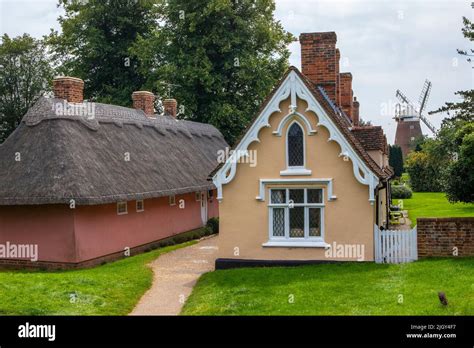 A Picturesque View Of The Almshouses And Windmill In The Town Of Thaxted In Essex Uk Stock