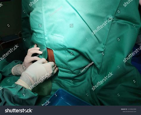 Anaesthetist Performing Spinal Anaesthesia Procedure Under Stock Photo ...