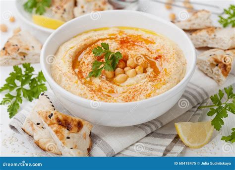 Hummus Or Houmous Appetizer Made Of Mashed Chickpeas Tahini Lemon