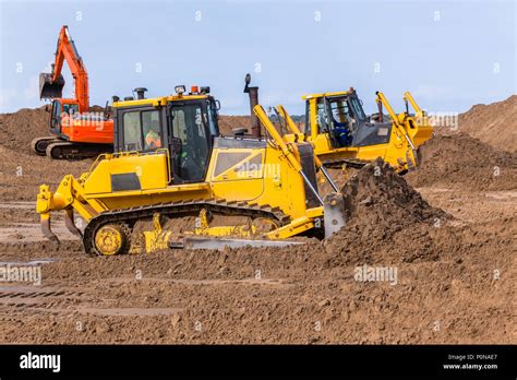 Earthworks Construction Heavy Dozer And Excavator Machines Pushing Sand