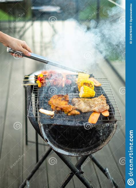 Delicious Grilled Meat With Smoke Bbq With Vegetables In Outdoor Barbecue Party Lifestyle