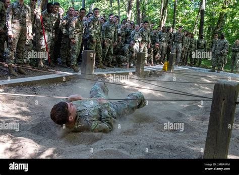 Cadets Watch A Demonstration Of The Low Wire Obstacle On The Obstacle