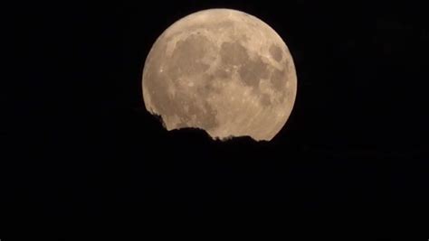 Photos Show Rare Blue Supermoon Rising In Night Sky As