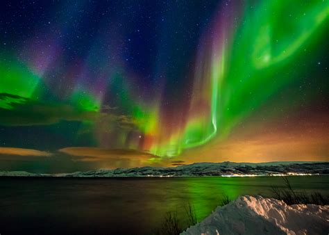 Multi-colored Aurora Borealis and a starry night sky over Tromsø