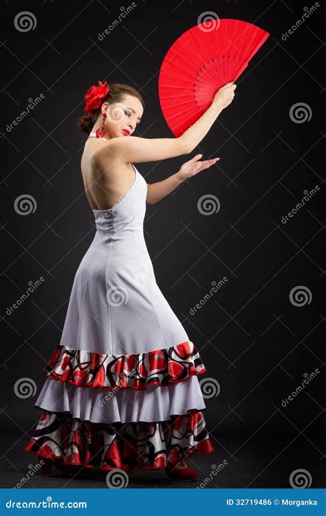 Young Spanish Woman Dancing Flamenco On Black Royalty Free Stock Image