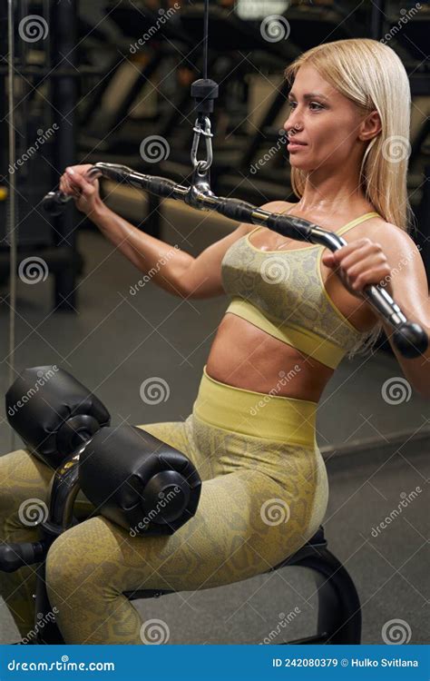 Delighted Blonde Woman Doing Exercise For Muscles Stock Image Image Of Pleasure Building