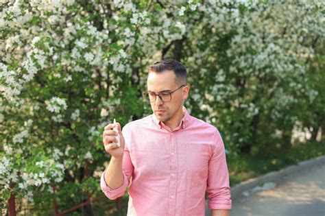 Premium Photo Man Using Nasal Spray While Walking