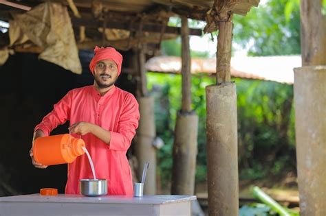 Premium Photo Indian Farmer Or Milkman Collecting Milk At Dairy Farm