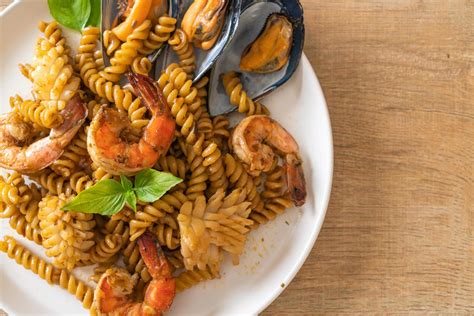 Stir Fried Spiral Pasta With Seafood And Basil Sauce 4851707 Stock