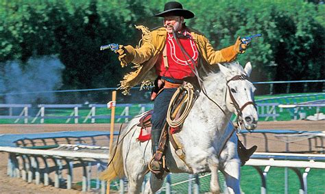 Cowboy On Horse With Gun