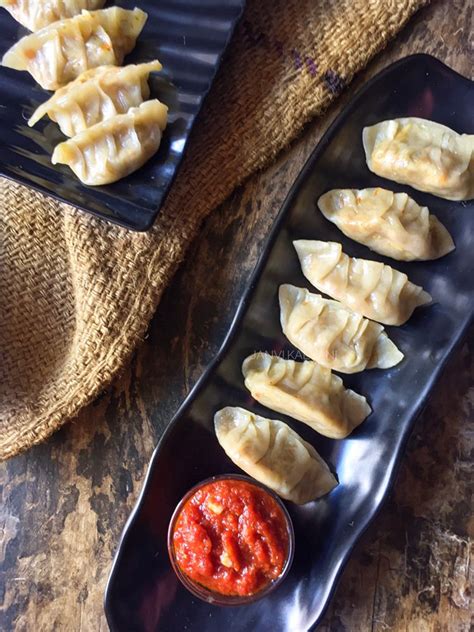 Veg Momos, a steamed or fried dumpling stuffed with mixed vegetables, is a delicious snack food ...