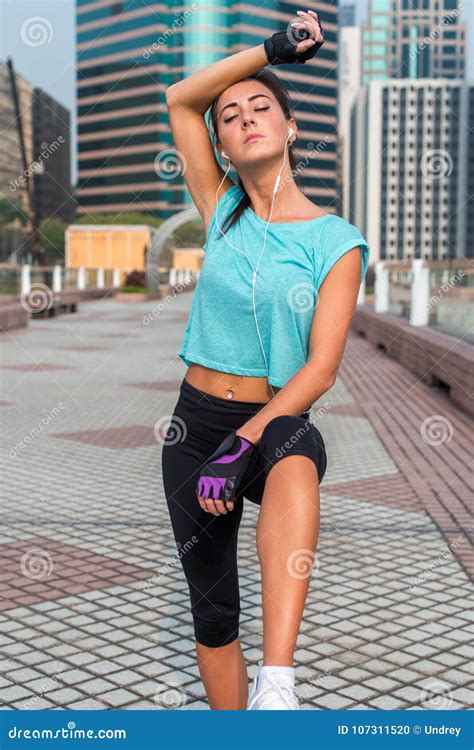 Portrait Of Tired Young Fitness Woman Taking A Break From Working Out