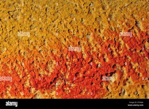 Red Paint Smudged On Yellow Textured Wall Background Stock Photo Alamy