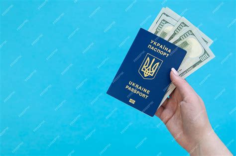 Premium Photo Biometric Ukrainian Passport And Money In A Hand On A