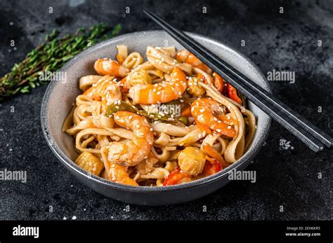 Stir Fry Udon Seafood Noodles With Shrimp Prawns In A Bowl Black