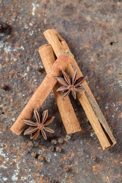 Premium Photo Cinnamon Sticks Anise Stars And Black Peppercorns On