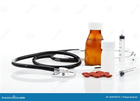 Stethoscope With Bottle Of Medicine Feeding Syringe Capsule On W Stock