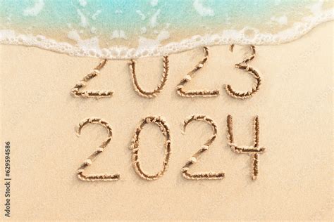 New Year Concept Photo Numbers Written On Sandy Beach With