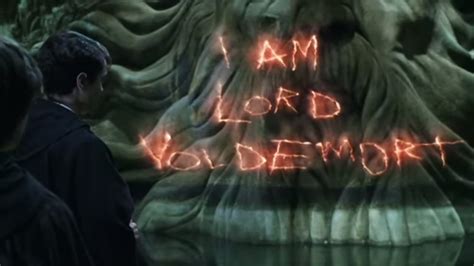 The Words I Am Lord Voldeworth Are Lit Up In Front Of An Image Of A Demon