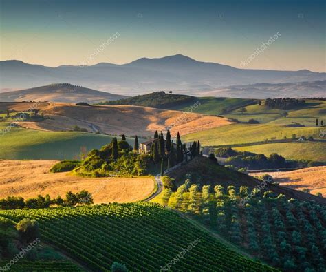 Scenic Tuscany landscape with rolling hills and valleys in golden ...