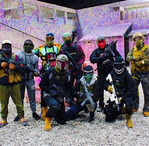 A Group Of Paintball Players Posing For A Photo