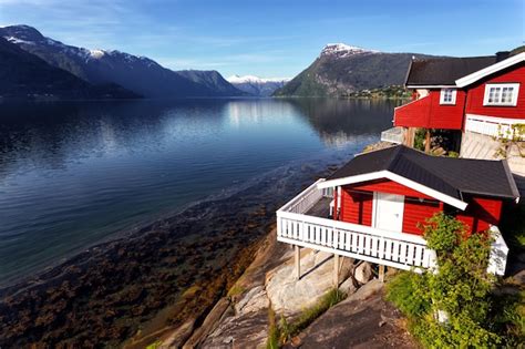 Premium Photo Rorbuer Traditional Norwegian Red Wooden House To Stand