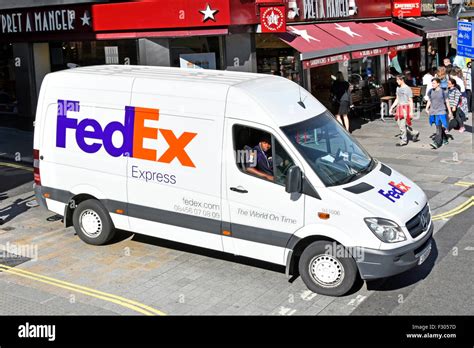 Fedex express delivery van and driver Stock Photo, Royalty Free Image ...