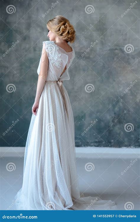 Bride Blonde Woman In A Modern Color Wedding Dress With Elegant Hair