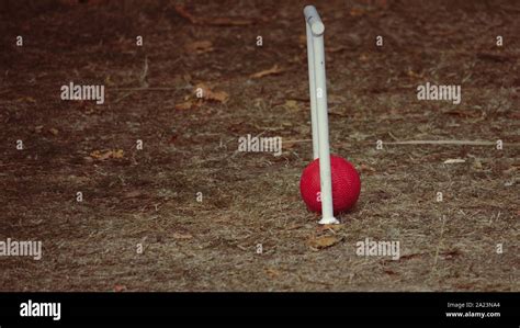 Red Croquet Ball Through Hoop Stock Photo Alamy