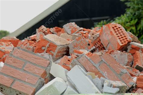 Pile Of Broken Red Bricks On Construction Site Photo Background And