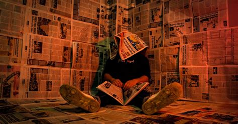 person  newspaper room  creative lighting  stock photo