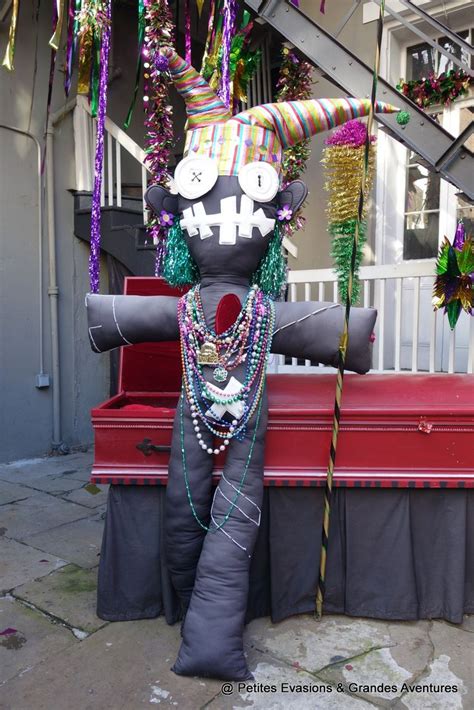 A Decorated Bench In Front Of A Building With Decorations Hanging From