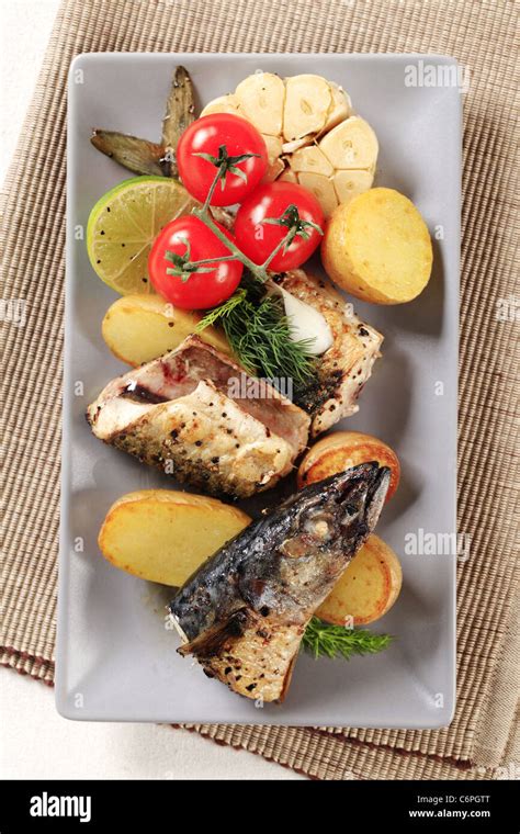 Pan Fried Mackerel Served With Roasted Potatoes Stock Photo Alamy