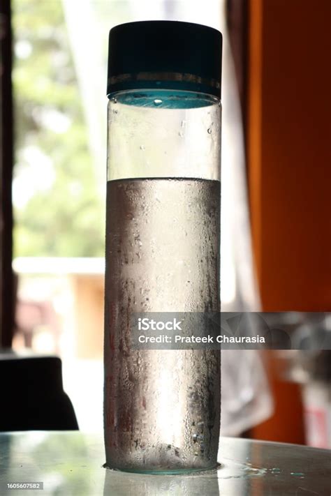 A Cylindrical Chilled Water Bottle With A Bokeh Background Stock Photo - Download Image Now - iStock