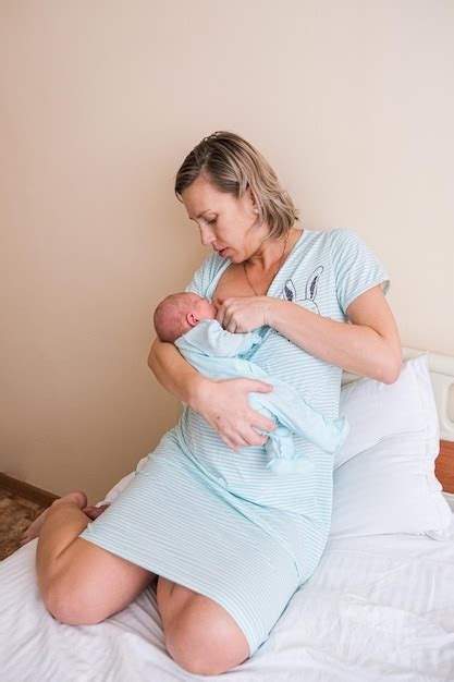 Premium Photo Newborn Baby Sleeping In Hospital Bassinet With Mom