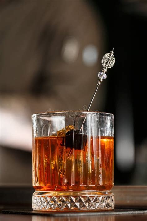 Old Fashioned Cocktail Consisting Of Bourbon Angostura Bitter Sugar Cubes A Few Drops Of