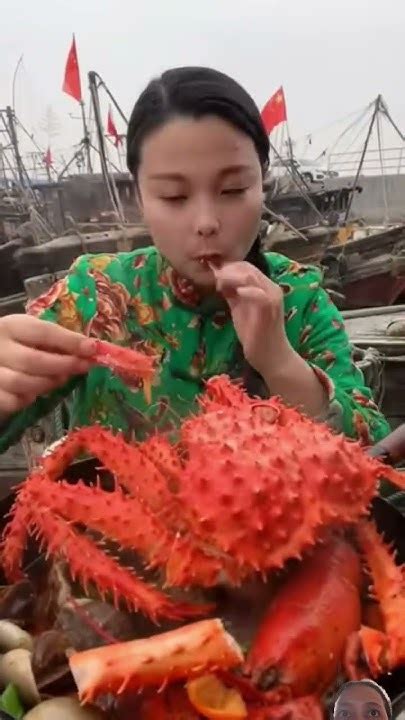 Female Fisherman Is Eating King Crab Prawns Conch Lobster Octopus