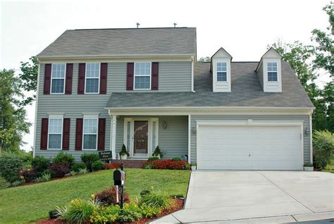 Stylish And Bold Dark Grey House With Burgundy Shutters Click To See The Stunning Transformation