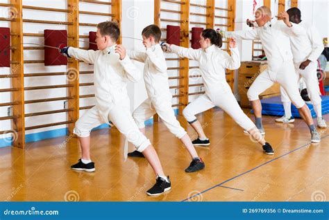 Group Practicing Fencing Techniques in Gym Stock Photo - Image of fight, combination: 269769356