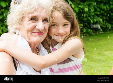 Portrait Of Grandmother And Granddaughter Hugging Stock Photo Alamy